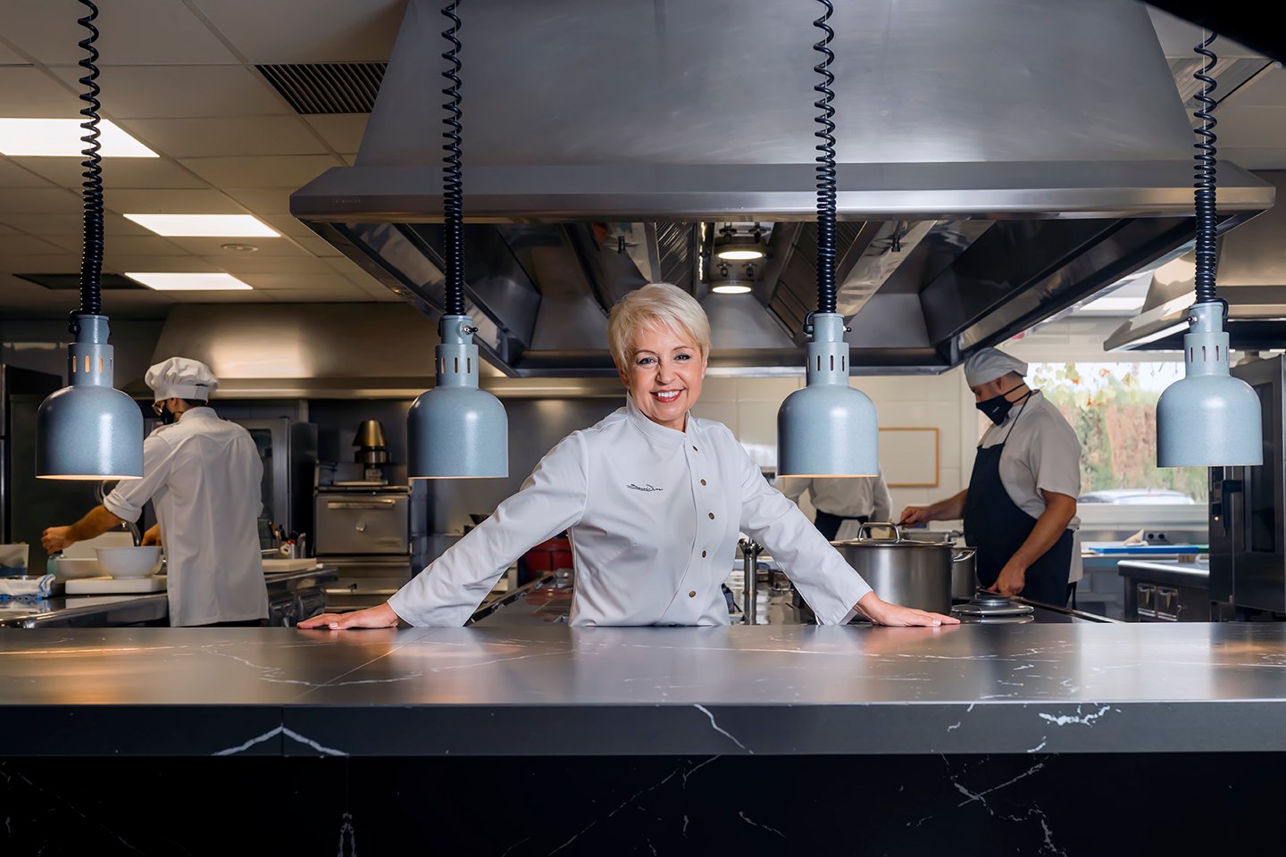 Image of chef Susi Díaz in the kitchen of her restaurant, La Finca.